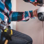 Technician installing CCTV